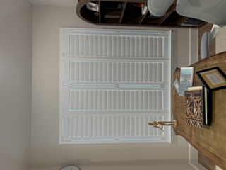 White window shutters in a living room